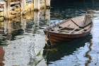 Alesund, Norway. Brown wooden canoe, water reflection. Coastal Print
